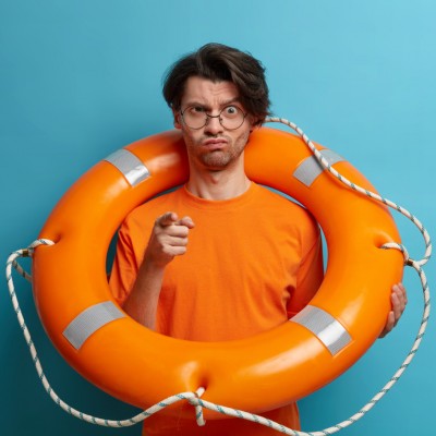 serious-displeased-strict-man-rescuer-points-you-warns-about-danger-water-poses-with-lifebuoy-works-tropical-beach-dressed-orange-t-shirt-ready-salvation-sinking-person 1.1.jpg
